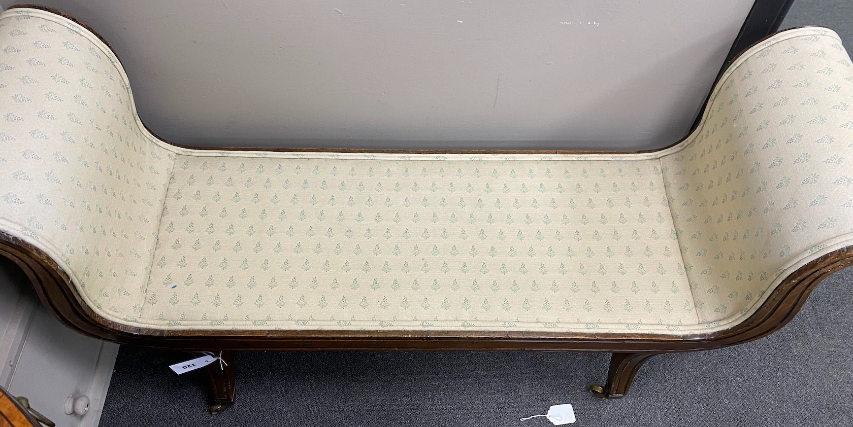 A Regency style mahogany scroll end window seat, width 122cm, depth 37cm, height 65cm